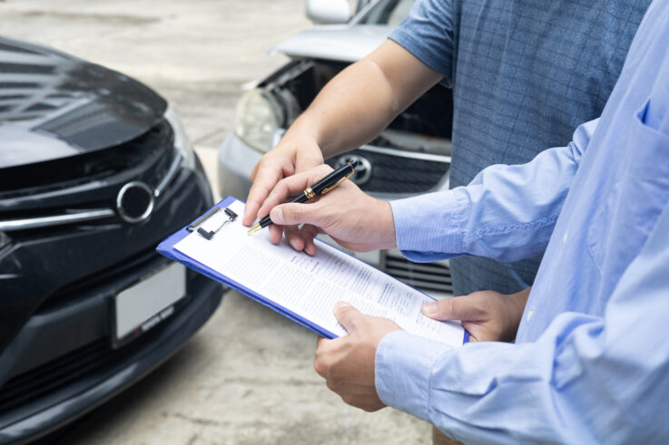 insurance officer writing clipboard