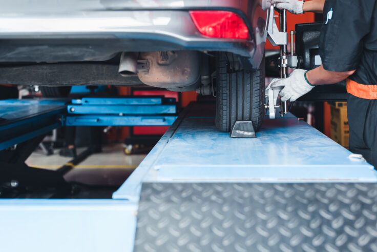 Frame straightening and wheel alignment performed on a vehicle